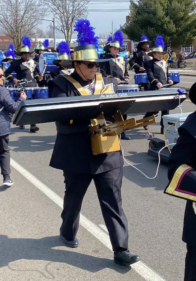 Keyboard performer using a Walkabout Carrier in a marching environment